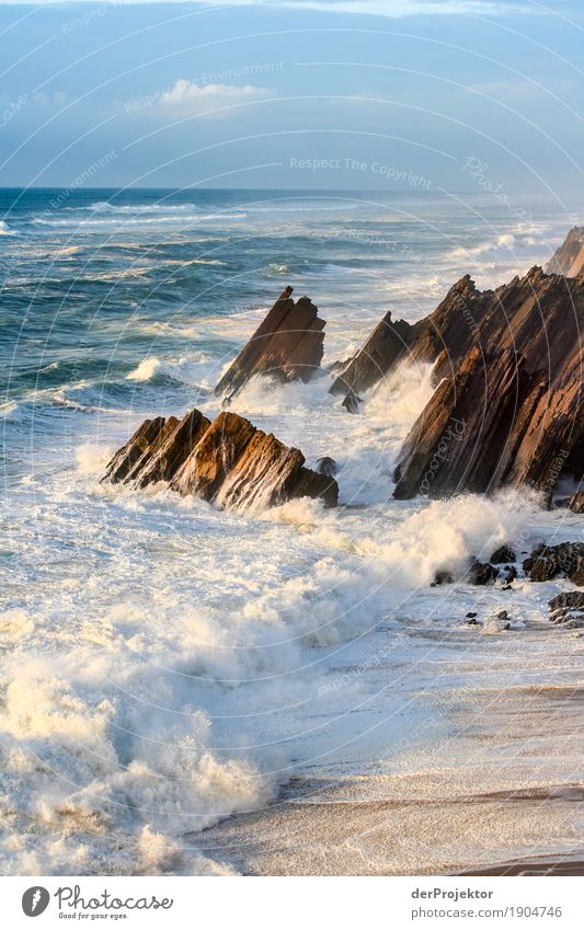 Rocks with spray in sunset in Portugal Looking Central perspective Deep depth of field Reflection Silhouette Contrast Shadow Light Day Copy Space bottom