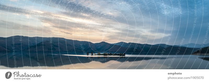 Wide panoramic landscape of a mountain lake with small island in the middle Island Winter Mountain Nature Landscape Water Sky Clouds Sunrise Sunset Autumn Tree