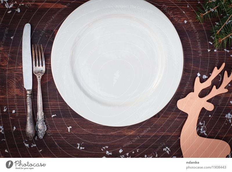 White plate with fork and knife on the wooden table Dinner Crockery Plate Knives Fork Table Kitchen Restaurant Feasts & Celebrations Christmas & Advent