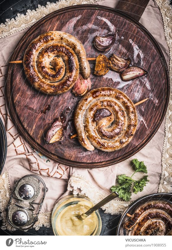 Grilled sausage snail served with mustard Food Sausage Nutrition Lunch Crockery Style Design Table Kitchen Restaurant Barbecue (apparatus) Bratwurst Gourmet