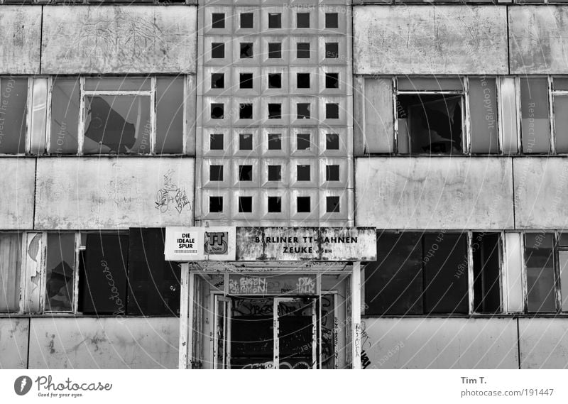 over Germany Europe Capital city Deserted High-rise Industrial plant Factory Ruin Facade Window Door Sadness Lose Black & white photo Exterior shot Day