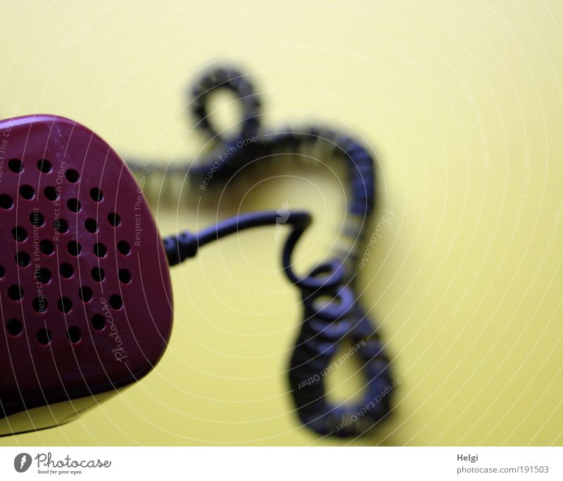 Close-up of an old telephone handset with ringed cable Telephone Loudspeaker Cable Telecommunications Plastic Listening To talk Living or residing Old Esthetic