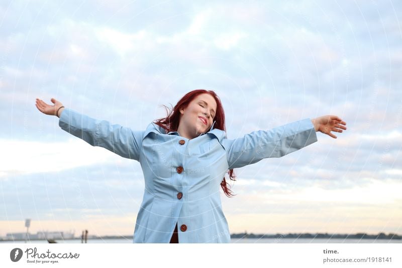 Enjoy. Feminine Woman Adults 1 Human being Sky Clouds Horizon Coast River bank Coat Red-haired Long-haired Relaxation To enjoy Dream Free Beautiful Emotions