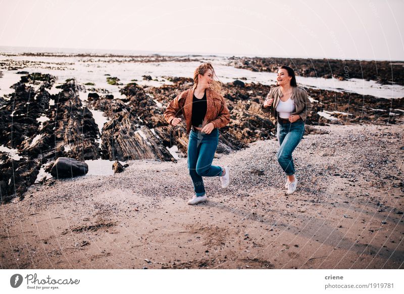 Teenager girls having fun running on the beach Lifestyle Joy Relaxation Freedom Beach Ocean Human being Feminine Young woman Youth (Young adults) Sister