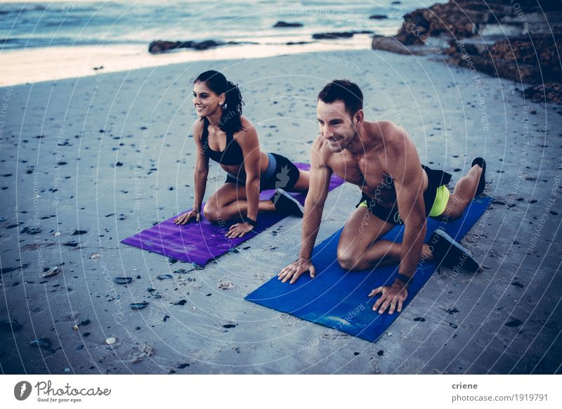 Fit young adult african women doing yoga on beach - a Royalty Free Stock  Photo from Photocase