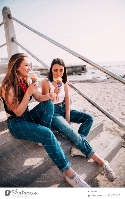 Caucasian Teenager girls enjoying ice cream on the beac Ice cream Eating Lifestyle Joy Leisure and hobbies Vacation & Travel Summer Beach Ocean Human being