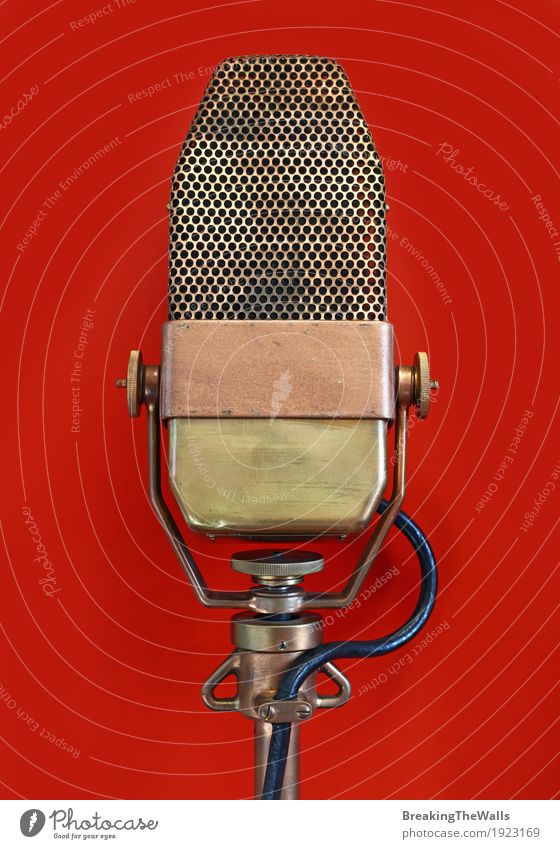 Vintage old retro vocal metal microphone over red Music Hardware Cable Technology Concert Metal Historic Retro Red vintage Voice perform Interview show gig