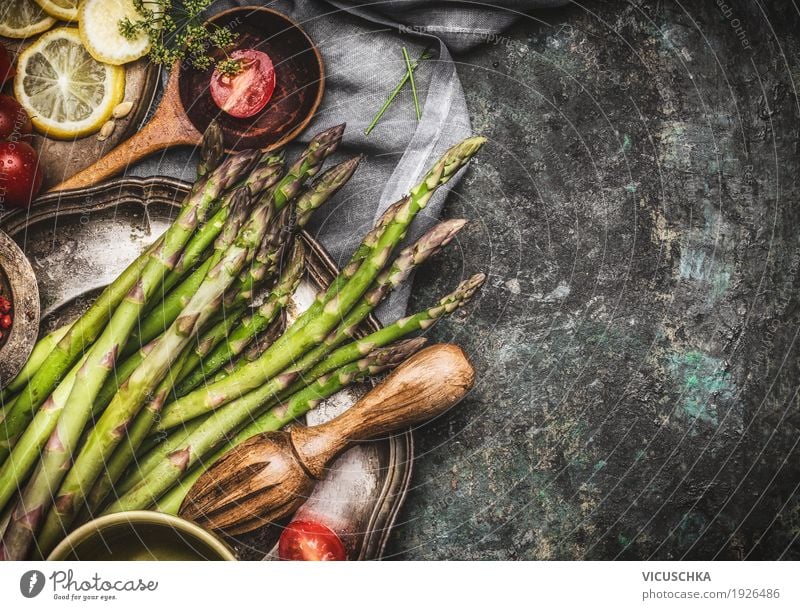 Green asparagus on the kitchen table Style Design Healthy Healthy Eating Life Table Kitchen Wooden spoon Asparagus Vegan diet Cooking Kitchen Table Lemon