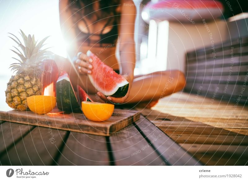 women in bikini enjoying fresh fruit platter at the pool Fruit Orange Eating Lifestyle Joy Relaxation Swimming pool Vacation & Travel Summer Sunbathing Garden