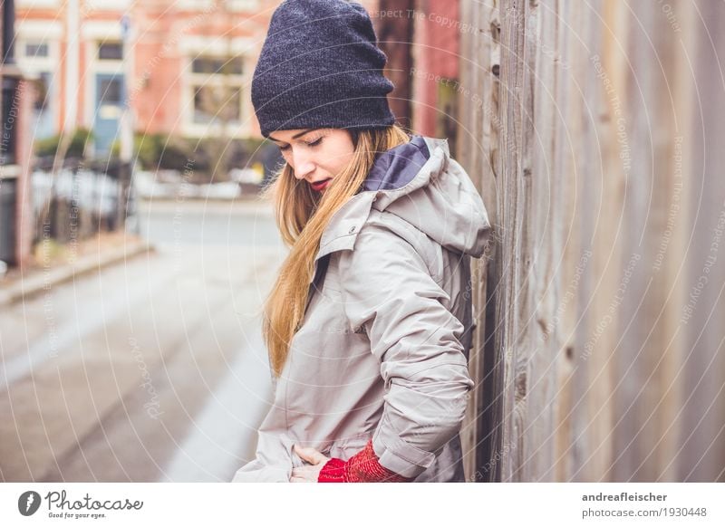 Young woman waiting for her boyfriend at the wooden fence Lifestyle Trip City trip Feminine Youth (Young adults) 1 Human being 18 - 30 years Adults Sweater