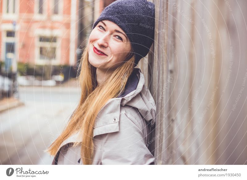 Young woman leans against wooden fence and is happy 1 Human being 18 - 30 years Youth (Young adults) Adults Small Town Outskirts Blonde Long-haired Smiling