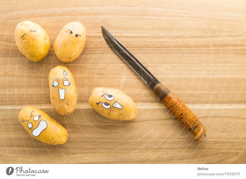 Potatoes in panic fear of a sharp armor knife Vegetable Cooking Nutrition Knives Chopping board Wood Metal Steel Creepy Delicious Funny Brown Black White
