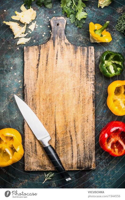 Cutting board with kitchen knife and coloured peppers Food Vegetable Lettuce Salad Herbs and spices Nutrition Organic produce Vegetarian diet Diet Crockery