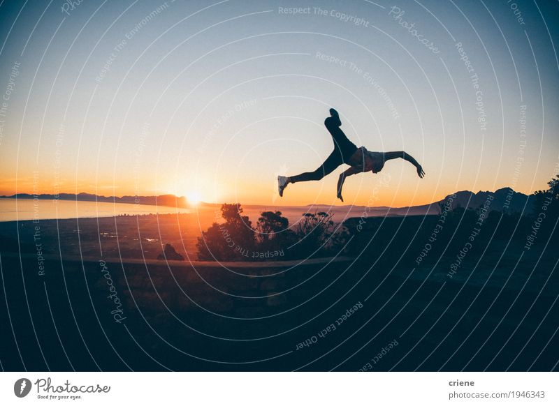 Silhouette of young adult man jumping high in sunset Lifestyle Joy Vacation & Travel Adventure Freedom Summer Mountain Human being Masculine Young man
