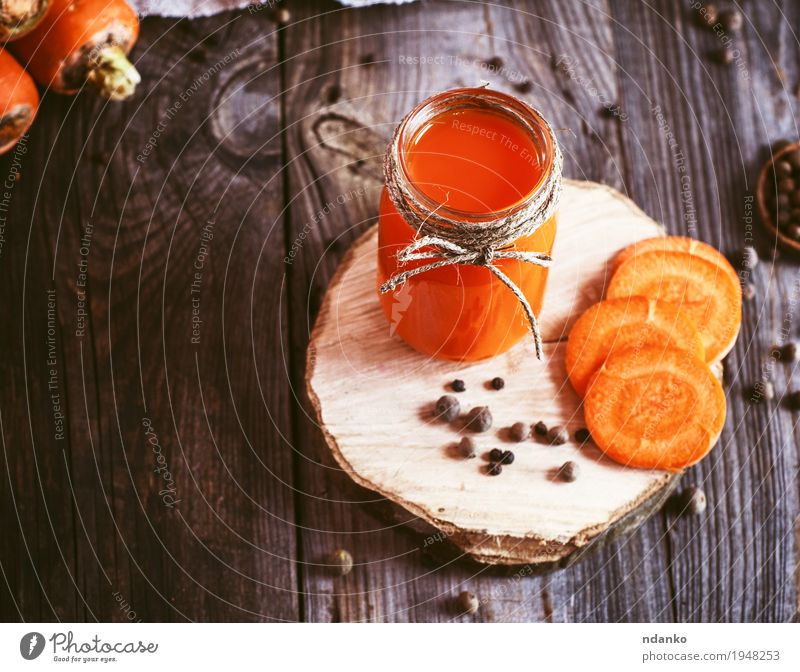 Fresh carrot juice in a glass jar on a wooden surface Vegetable Fruit Herbs and spices Vegetarian diet Diet Beverage Drinking Juice Health care Table
