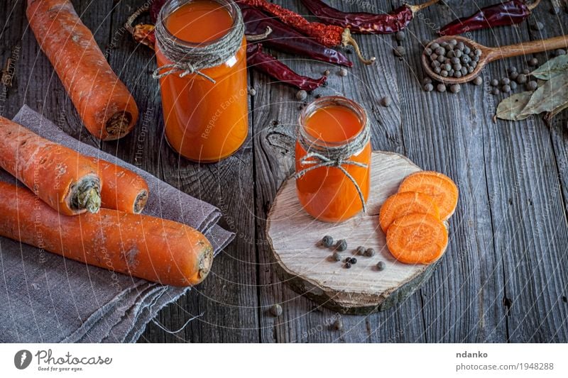 Fresh carrot juice with pulp among the vegetables Vegetable Herbs and spices Nutrition Vegetarian diet Diet Beverage Drinking Juice Bottle Table Nature Wood