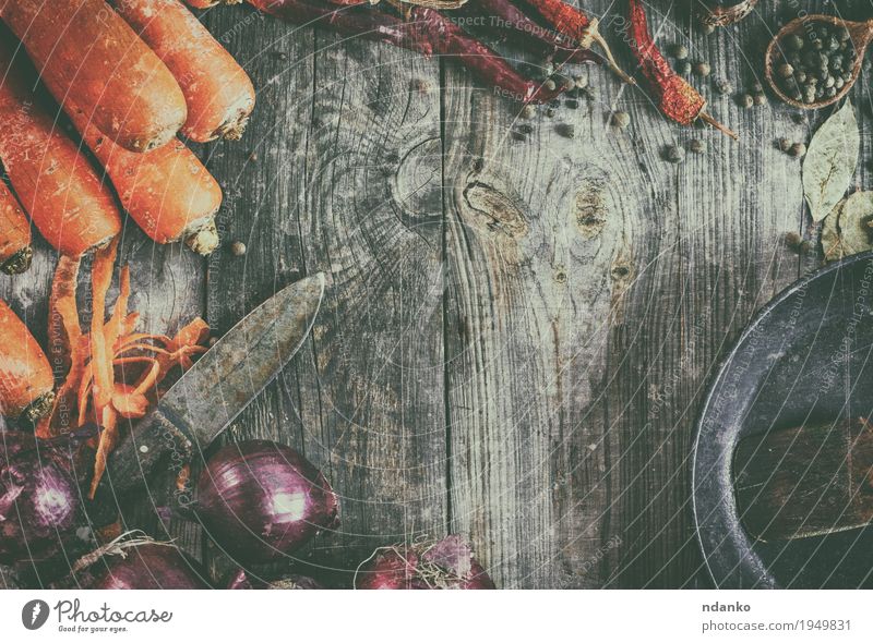 Fresh carrots and red onion with a frying pan Food Vegetable Herbs and spices Vegetarian diet Pan Spoon Table Kitchen Wood Old Brown Gray Orange Red Carrot