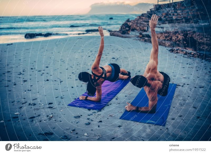 Young adult couple doing fitness exercises on the beach Lifestyle Personal hygiene Healthy Wellness Well-being Leisure and hobbies Beach Ocean Waves Sports
