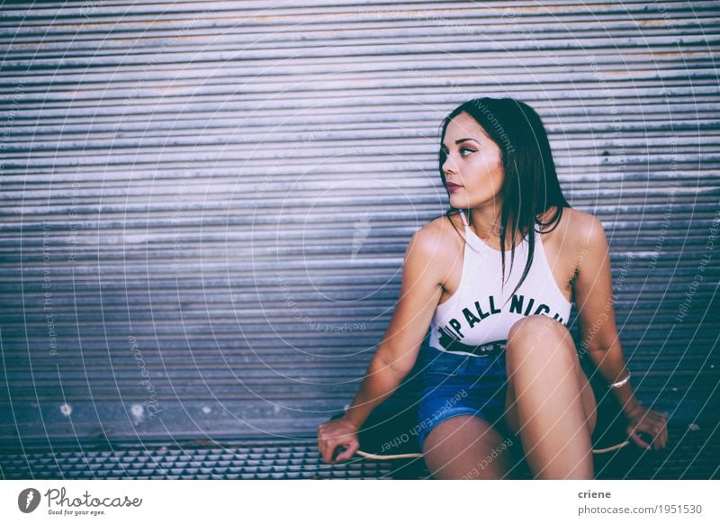 Young caucasian women sitting on skateboard in the street Lifestyle Joy Relaxation Leisure and hobbies Sports Feminine Young woman Youth (Young adults) Woman