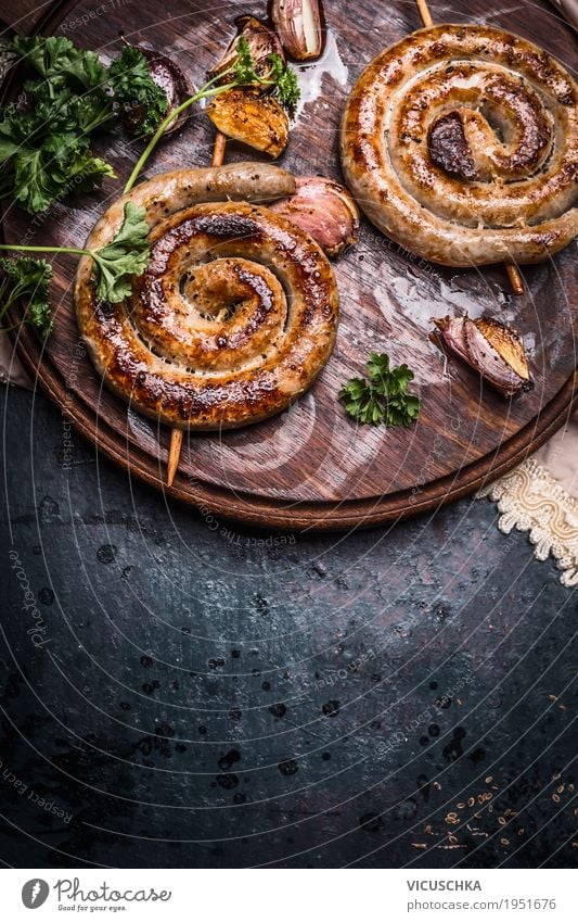 Grilled sausages with garlic and spices Food Sausage Nutrition Design Table Barbecue (apparatus) Style Bratwurst Gourmet Snack Food photograph Rustic
