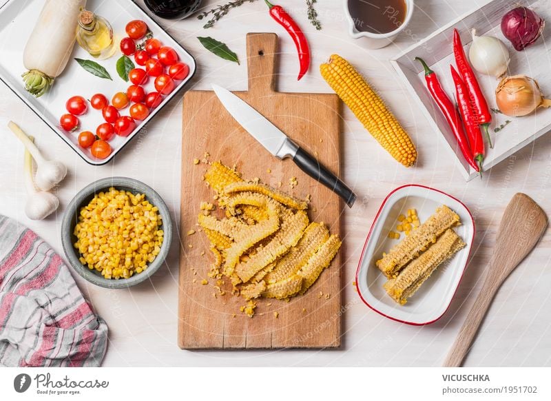 Corn cooking, preparation with chopping board, knife and ingredients Food Vegetable Herbs and spices Cooking oil Nutrition Lunch Dinner Organic produce