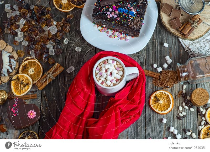 cup of chocolate drink with marshmallows wrapped in red scarf Food Cake Dessert Candy Herbs and spices Beverage Hot Chocolate Coffee Plate Cup Table Scarf Sieve