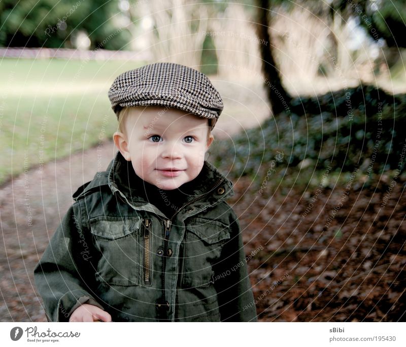 Finally playing outside again Contentment Children's game Human being Toddler Boy (child) Infancy Face 1 1 - 3 years Nature Tree Leaf Park Hat Cap Blonde