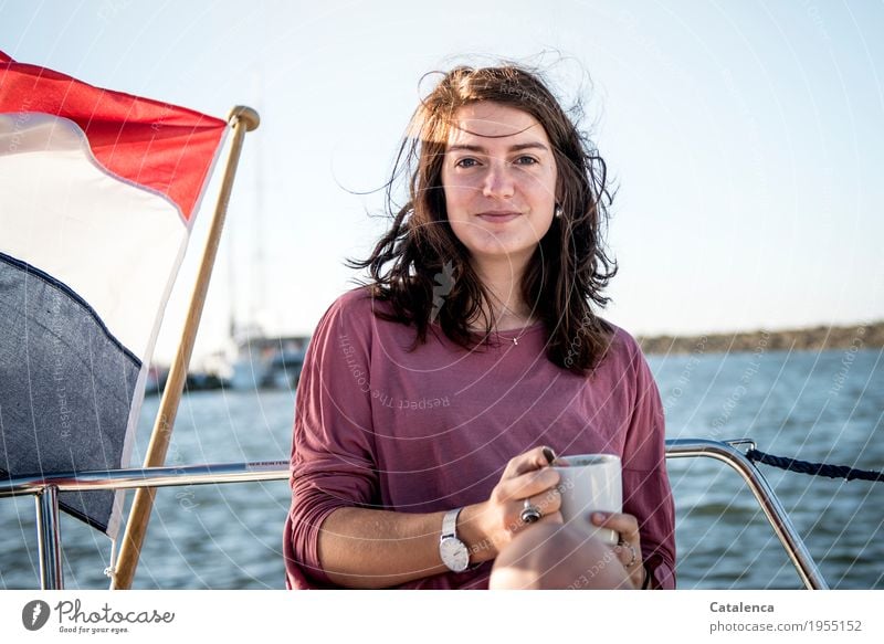 Girl with coffee cup Young woman Coffee Drinking Morning Beverage Cup Espresso Food Café hair windy Disheveled Sailboat yacht flag Nederland smilingly cheerful