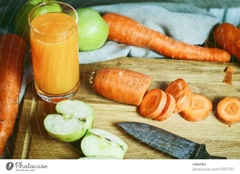 glass of fresh juice of carrots and apples with fresh vegetables Vegetable Fruit Apple Dessert Nutrition Vegetarian diet Diet Drinking Juice Glass Health care