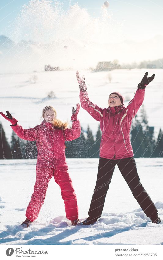 Mother enjoying the snow with her daughter outdoors Lifestyle Joy Happy Winter Snow Winter vacation Human being Girl Woman Adults Parents Family & Relations