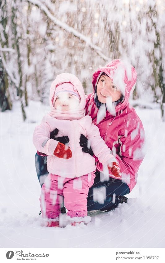 Mother spending time with her little daughter outdoors Lifestyle Joy Happy Leisure and hobbies Playing Trip Winter Snow Child Human being Baby Girl Woman Adults