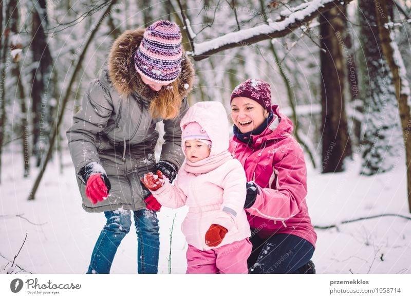 Mother spending time with her children outdoors Lifestyle Joy Happy Leisure and hobbies Playing Winter Snow Child Human being Baby Girl Woman Adults Parents
