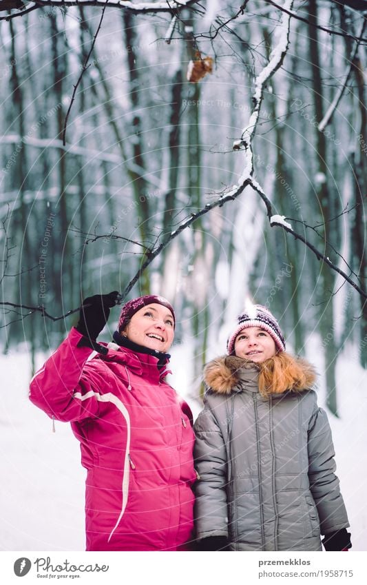 Mother and daughter during the walk in the forest Lifestyle Joy Trip Winter Snow Winter vacation Human being Girl Woman Adults Parents Family & Relations 2