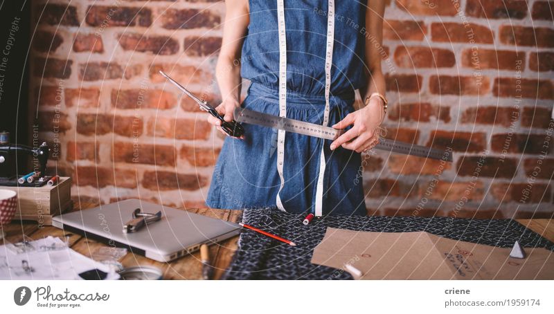 Young female fashion designer holding tools in her hands Design Leisure and hobbies Work and employment Profession SME Notebook Young woman Youth (Young adults)