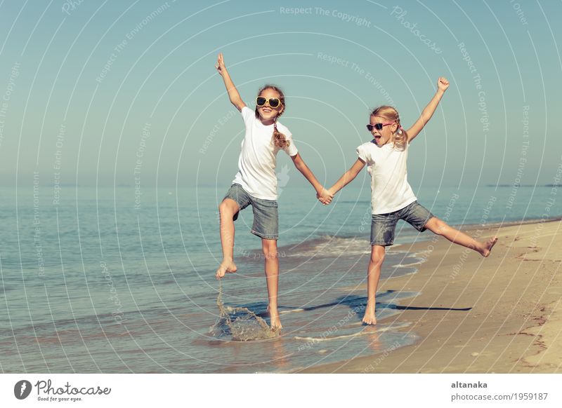 two sisters playing on the beach Lifestyle Joy Happy Beautiful Relaxation Leisure and hobbies Playing Vacation & Travel Freedom Summer Sun Beach Ocean Success