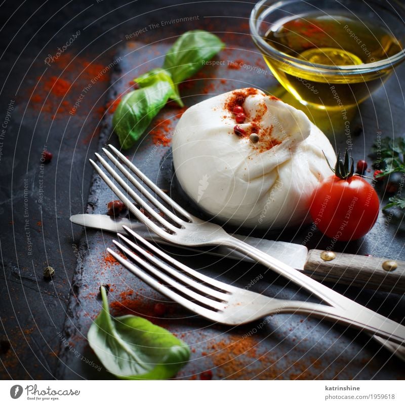 Italian cheese burrata, tomatoes, basil and olive oil Cheese Dairy Products Vegetable Herbs and spices Cooking oil Nutrition Vegetarian diet Italian Food Fork