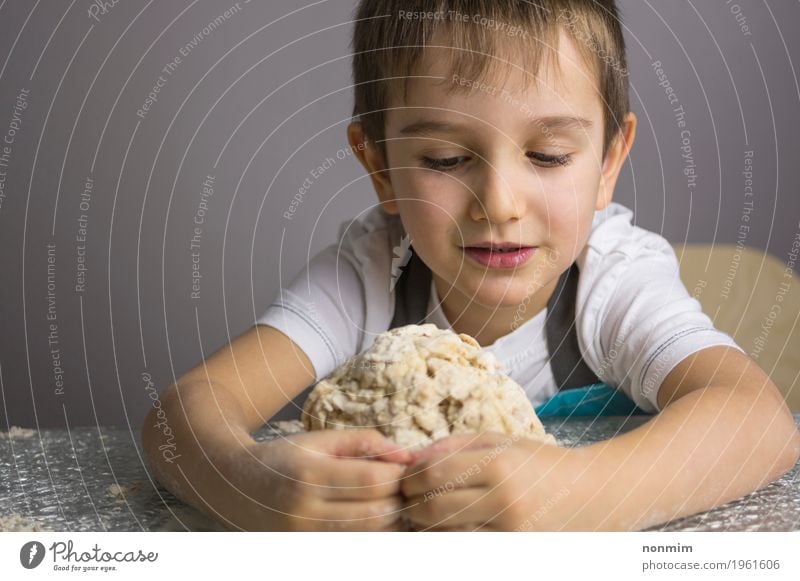 Little boy is kneading raw pizza dough and making a hug Dough Baked goods Bread Kitchen Child School Boy (child) Infancy Make Small Cute Innocent Delightful
