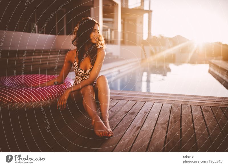 Young caucasian women relaxing at swimming pool in sunset Lifestyle Joy Wellness Relaxation Spa Swimming pool Swimming & Bathing Vacation & Travel Tourism