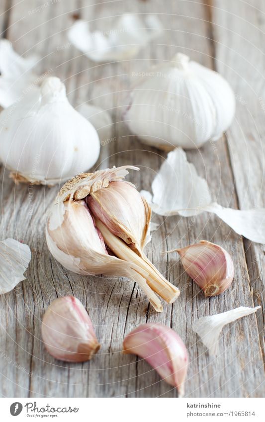 Organic garlic on the old wooden table close up Vegetable Herbs and spices Vegetarian diet Table Old Fresh Gray White Decline bulb Clove food Garlic healthy