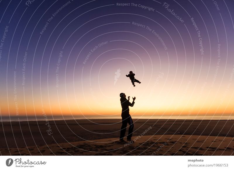 Man throws small child in the air Joy Happy Athletic Playing Vacation & Travel Tourism Far-off places Ocean Parenting Child Human being Masculine Baby