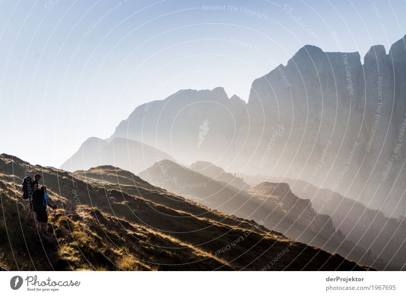 Mountains at sunrise backlit in South Tyrol V Top of the mountain Mountaineering White Blue Freedom Clouds Cloud formation Hiking Deserted Nature Alps