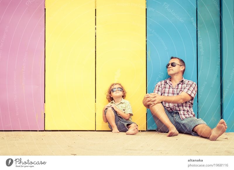 Father and son playing near the house at the day time. Lifestyle Joy Happy Relaxation Leisure and hobbies Playing Vacation & Travel Trip Freedom Summer Sun