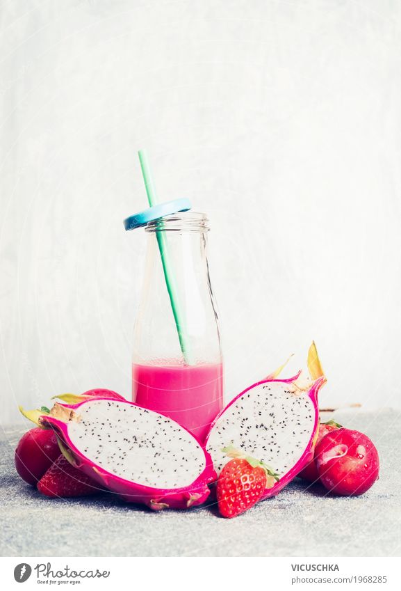 Pink smoothie in bottle with tropical fruits Fruit Organic produce Vegetarian diet Diet Beverage Juice Crockery Bottle Style Design Healthy Healthy Eating