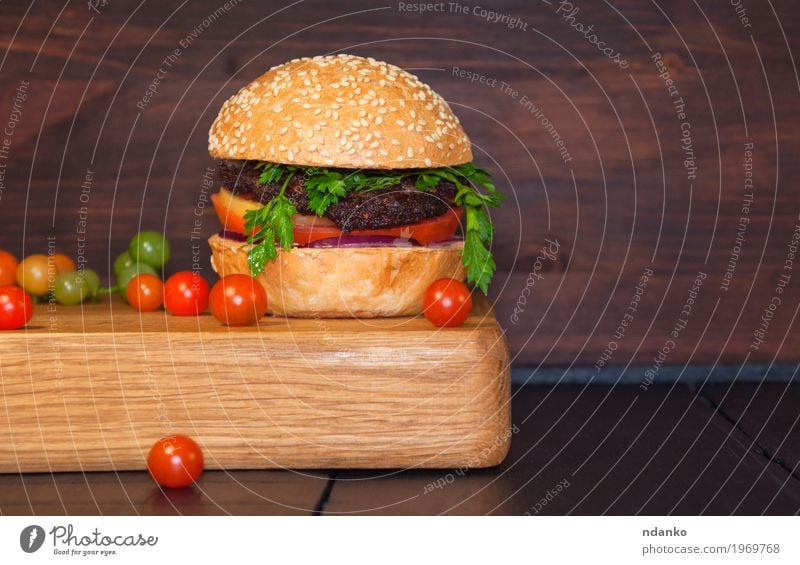 Meat sandwich sesame bun on a kitchen board Food Vegetable Bread Roll Nutrition Dinner Fast food Table Restaurant Eating Fresh Delicious Brown Red Black