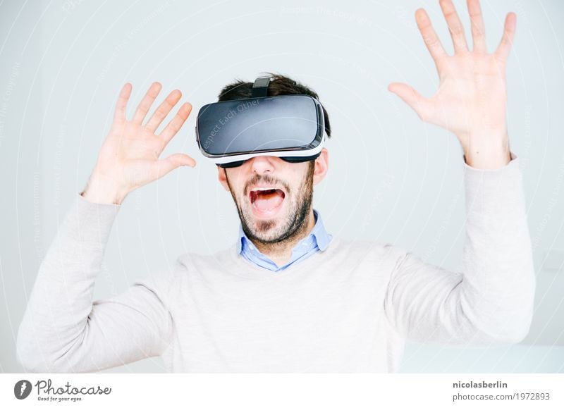 Man with VR glasses scared and raises his hands Joy Virtual virtual reality Science & Research Media industry Advertising Industry Telecommunications