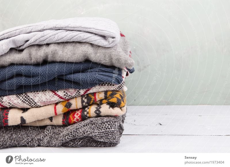 warm sweaters stacked on table Knit Winter Autumn Warmth Fashion Clothing Sweater Wood Soft White Comfortable Stack Wool knitwear fall Accumulation Cupboard