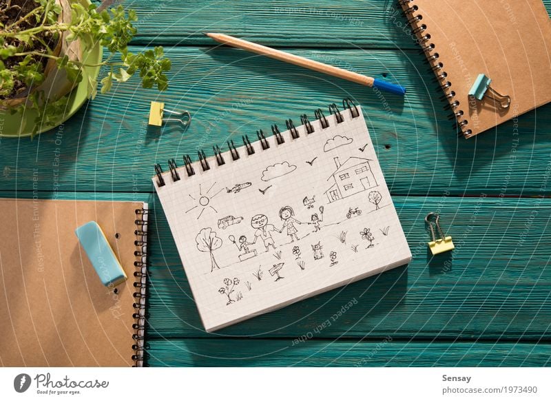 Happy family concept – sketch in the notebook Design Trip Sun House (Residential Structure) Desk Table Child School Workplace Mother Adults Father Sister
