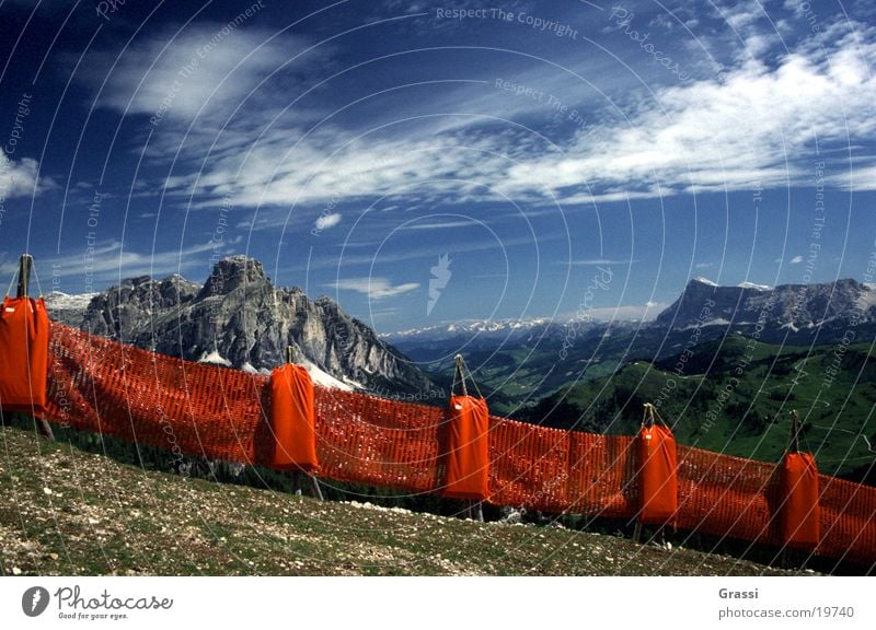 Dolomites Catch fence Ski run Mountain Clouds Track Ski lift Snow Weather Blue sky Air Pure Fence Border Boundary Protection Vantage point Landscape glaciers