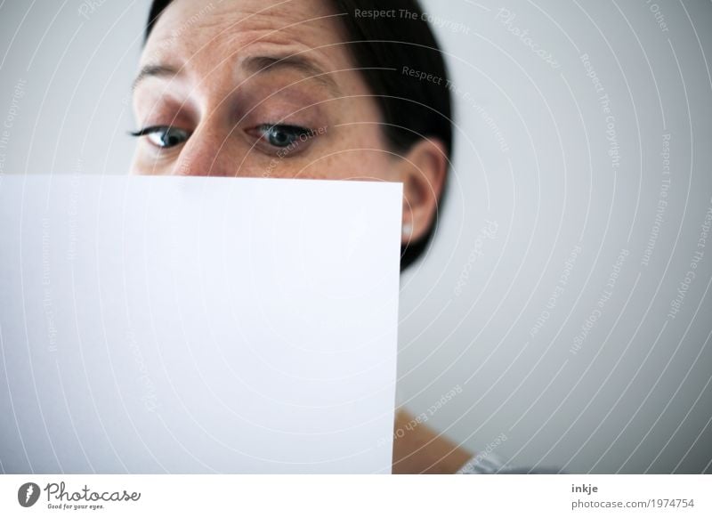 Woman face behind white sheet of paper Lifestyle Leisure and hobbies Education Adult Education Adults Face 1 Human being 30 - 45 years 45 - 60 years Paper