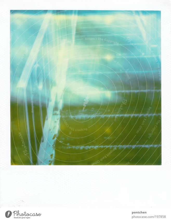 Polaroid shows part of a staircase made of metal. Verwunscjen. Fairytale atmosphere Stairs wood Metal Esthetic Fantastic Blue green Moody Dream Longing Mystic